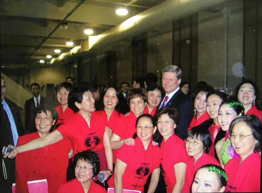 A group of people in red shirts

AI-generated content may be incorrect.